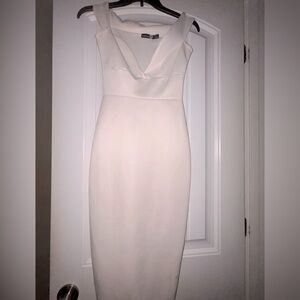White bodycon Boohoo dress with slight V-neck.